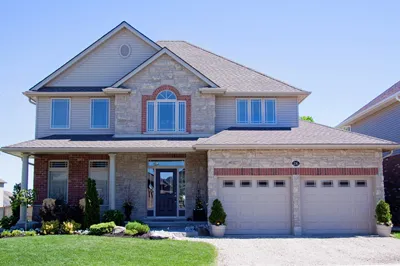 Two-story home exterior with an insulated front entry door