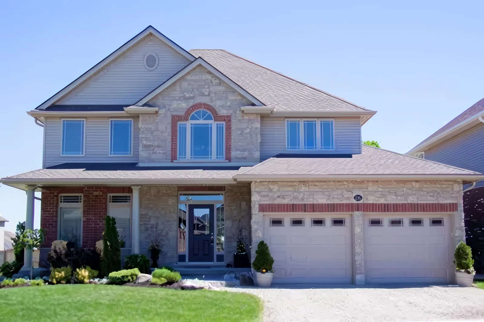 Two-story home exterior with an insulated front entry door